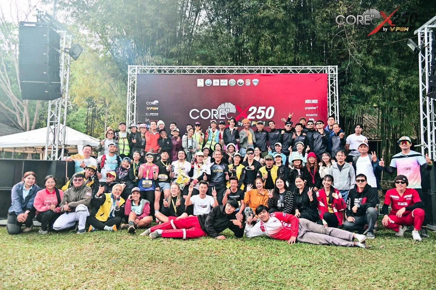 ภาพกลุ่มบริเวณป้าย CORE X250 ที่ค่ายเยาวชนเชียงดาว จากรายงานงานรอบปี 2568 คงภาพเต็มและตราต้นทาง